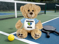 Pickleball Teddy Bear - Personalized 14" Honey Bear, Paddle Design - light blue sleeves, pictured on pickleball court. Perfect gift for pickleball players.